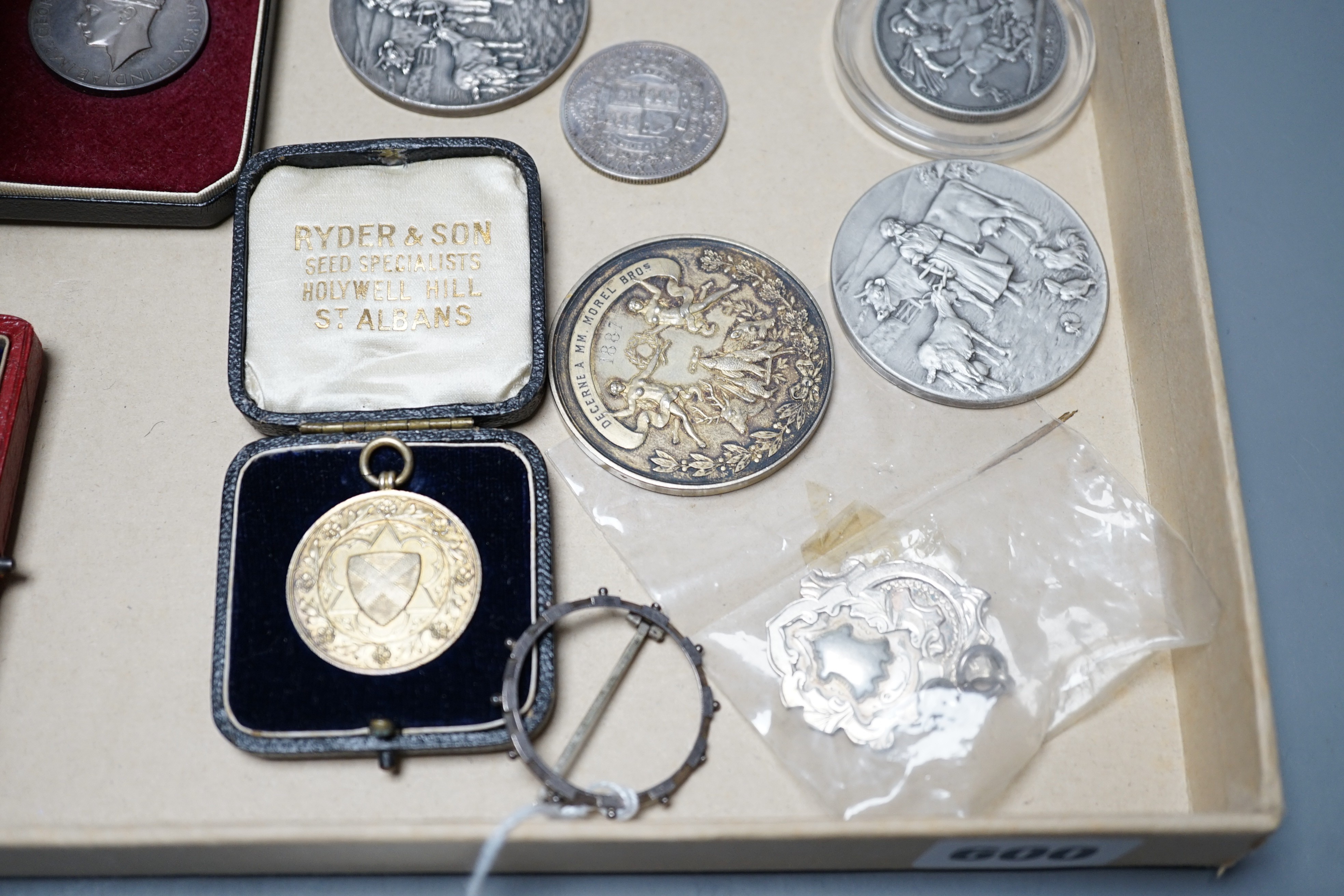 A group of silver commemorative medals, a Victoria 1889 crown, 1880 halfcrown, two cased ISM and to WW1 medals